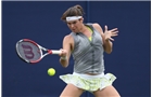 EASTBOURNE, ENGLAND - JUNE 14: Ajla Tomljanovic of Croatia plays a forehand against Jade Windley of Great Britain during their Women's Singles first round qualifying match on day one of the Aegon International at Devonshire Park on June 14, 2014 in Eastbourne, England.  (Photo by Steve Bardens/Getty Images)